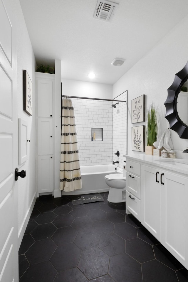 full bathroom with tile patterned flooring, vanity, shower / bath combination with curtain, and toilet