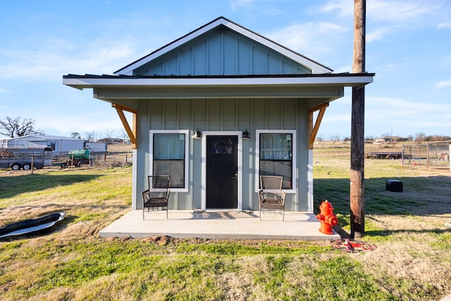 exterior space featuring a patio and a lawn