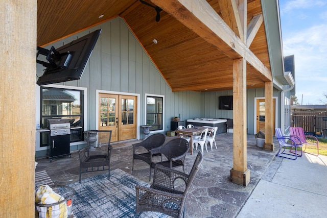 view of patio / terrace featuring grilling area, a hot tub, and french doors