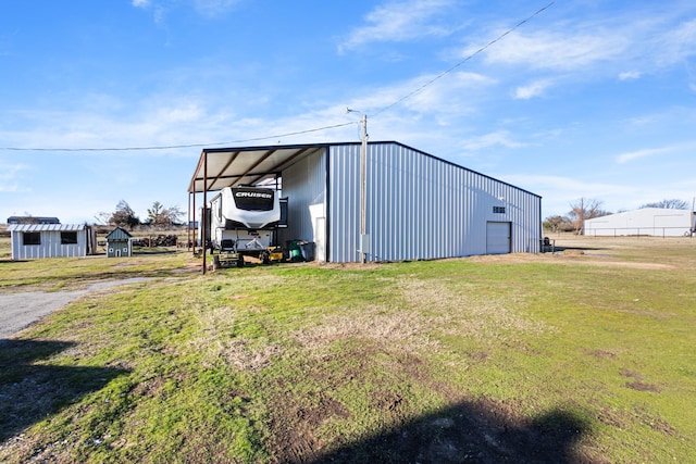 view of outbuilding featuring a garage and a lawn