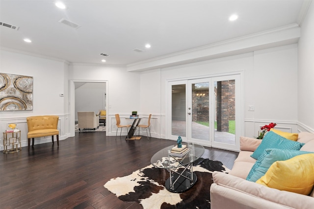 living area with recessed lighting, visible vents, wood finished floors, and crown molding