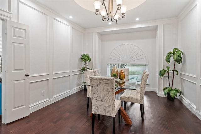 dining space with crown molding, dark hardwood / wood-style floors, and a notable chandelier