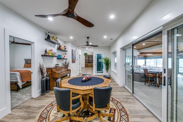 dining space featuring light hardwood / wood-style floors and ceiling fan