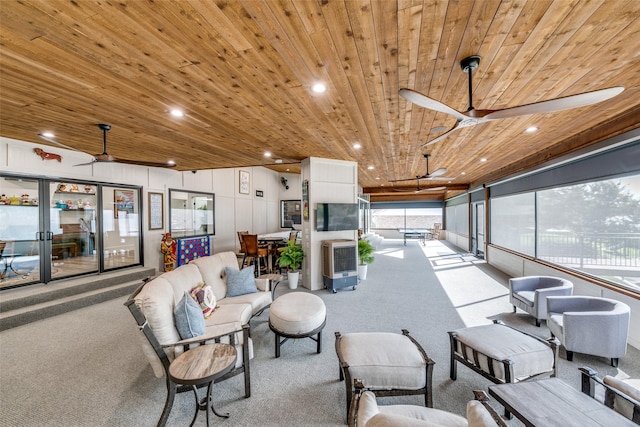 interior space with wood ceiling and ceiling fan