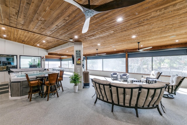 dining room with ceiling fan, lofted ceiling, light carpet, and wood ceiling