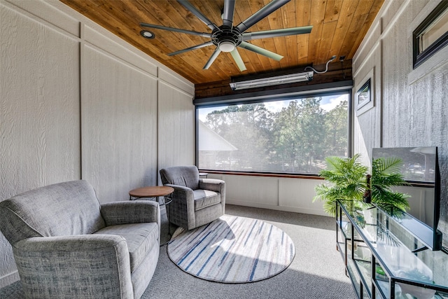 sunroom / solarium with wood ceiling and ceiling fan