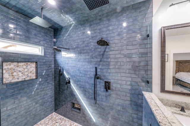 bathroom featuring sink and tiled shower