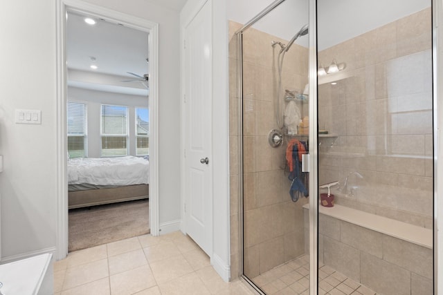 bathroom with walk in shower, ceiling fan, and tile patterned floors