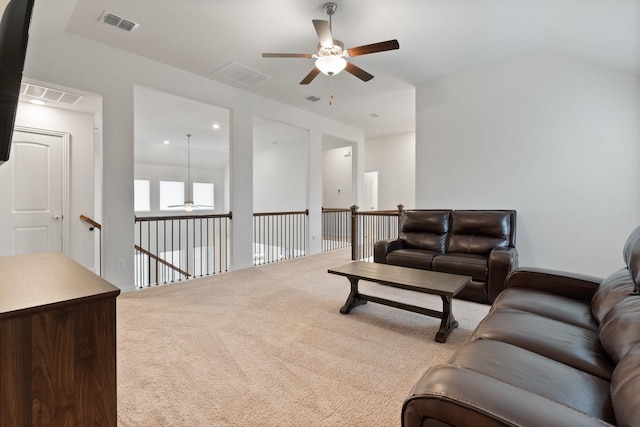 carpeted living room featuring ceiling fan