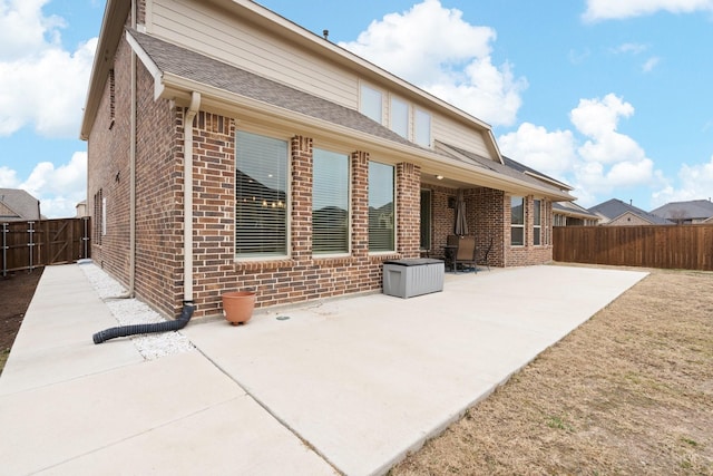 back of property featuring a patio area