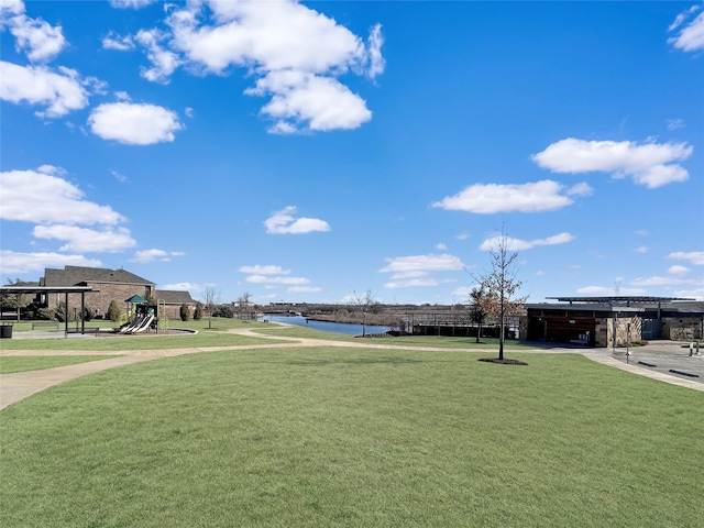 view of community with a yard and a playground