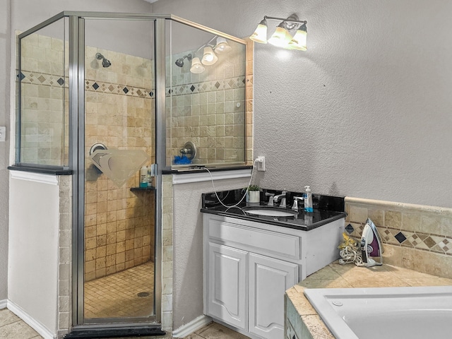 bathroom featuring vanity and shower with separate bathtub