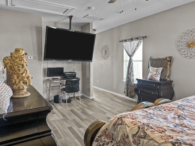 bedroom with ceiling fan and light hardwood / wood-style floors