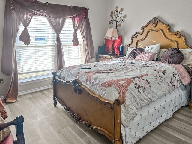 bedroom with light hardwood / wood-style flooring