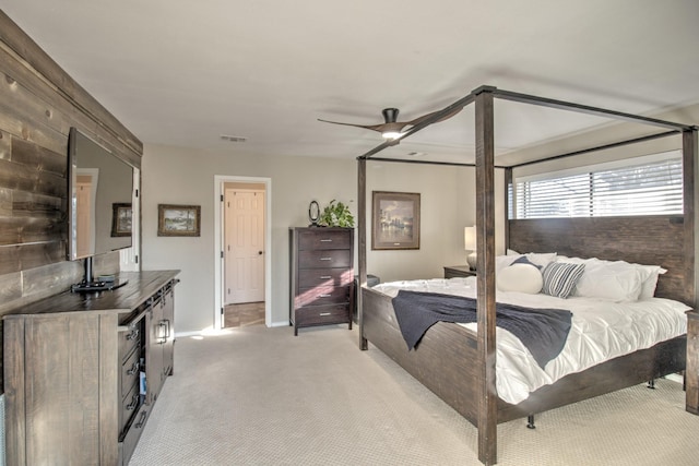 bedroom featuring light carpet and ceiling fan