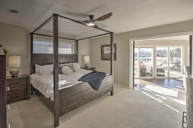 bedroom with light carpet and ceiling fan