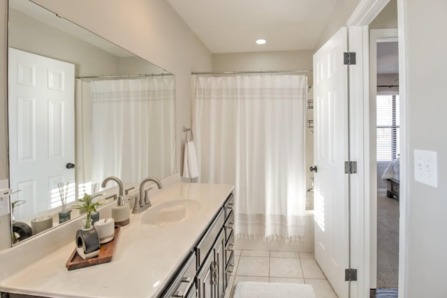 bathroom featuring tile patterned flooring, vanity, and shower / bathtub combination with curtain