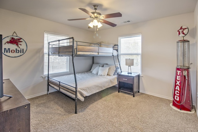 bedroom featuring ceiling fan and light carpet