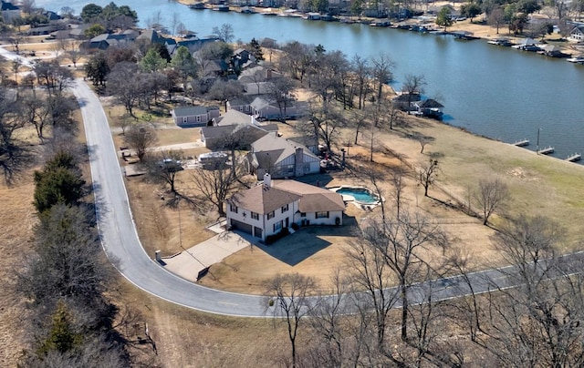 birds eye view of property featuring a water view