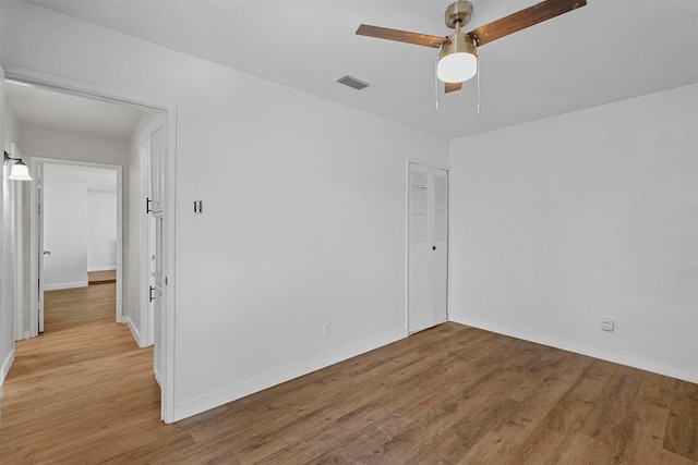 unfurnished room featuring ceiling fan and light hardwood / wood-style floors