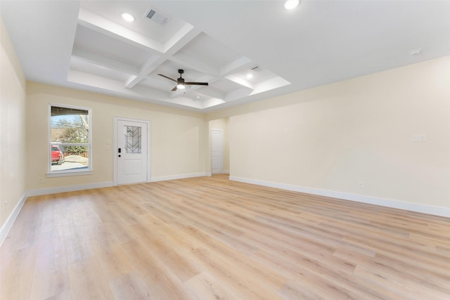 unfurnished room featuring beamed ceiling, coffered ceiling, ceiling fan, and light hardwood / wood-style flooring