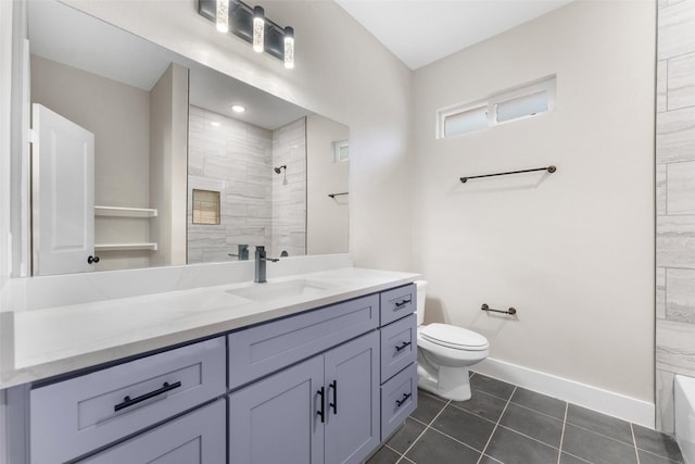 bathroom featuring vanity, tile patterned floors, toilet, and tiled shower