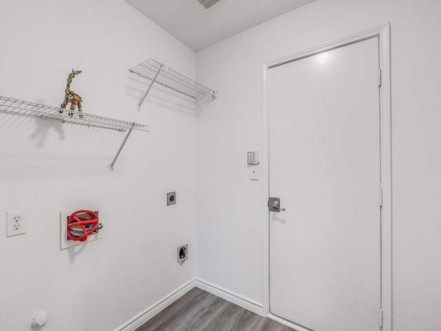 clothes washing area with hardwood / wood-style floors and hookup for an electric dryer