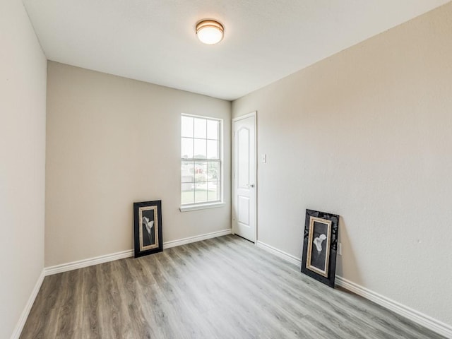 unfurnished room featuring light hardwood / wood-style flooring