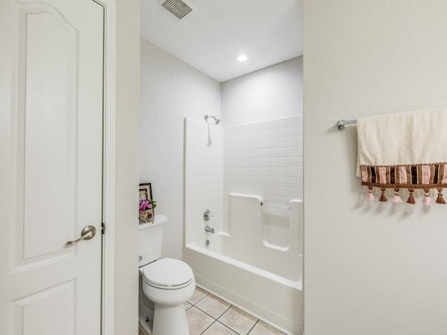 bathroom featuring toilet, bathtub / shower combination, and tile patterned flooring