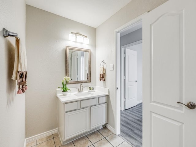 bathroom featuring tile patterned flooring and vanity