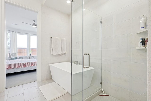 bathroom featuring tile walls, tile patterned floors, shower with separate bathtub, and ceiling fan