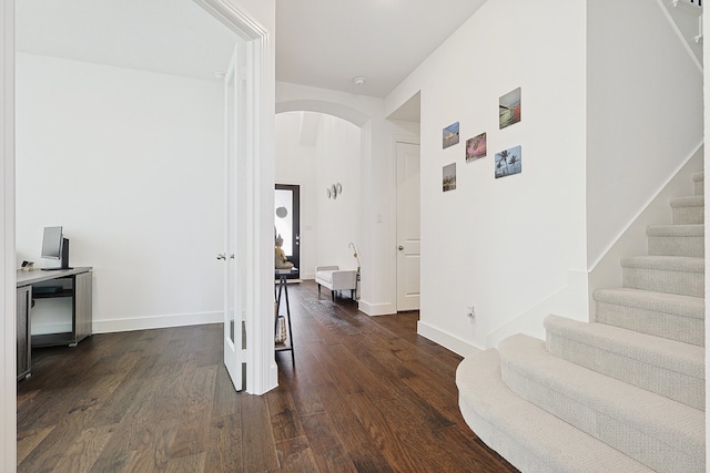 hall with dark wood-type flooring