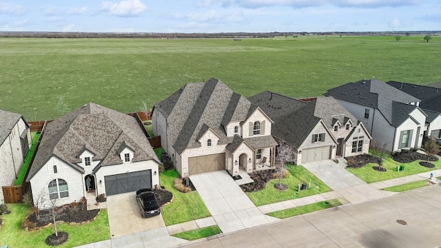 birds eye view of property featuring a rural view