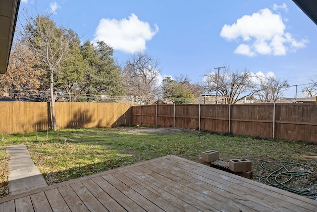 wooden deck with a lawn