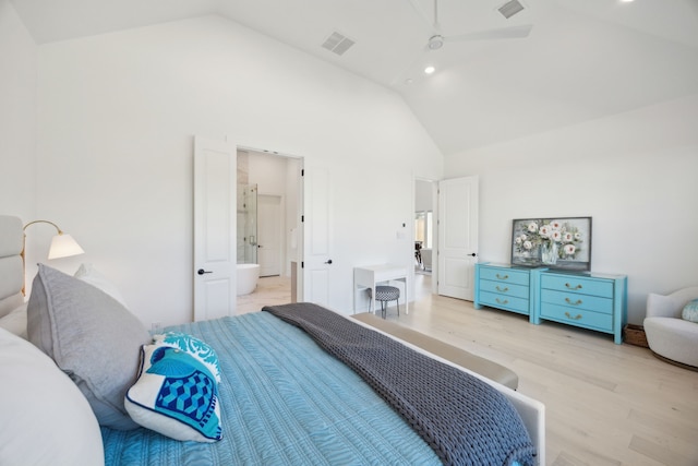 bedroom with high vaulted ceiling and light hardwood / wood-style flooring