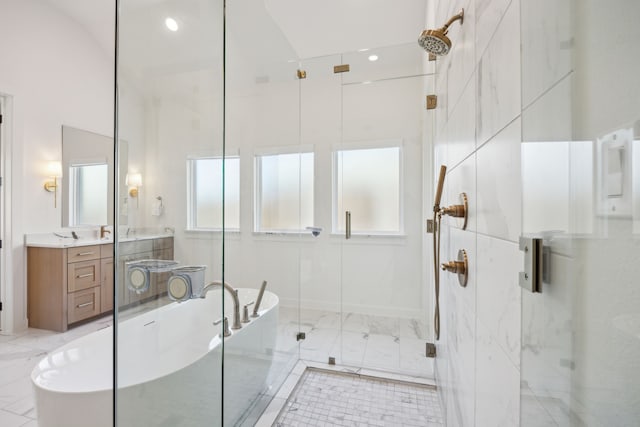 bathroom featuring vanity and plus walk in shower