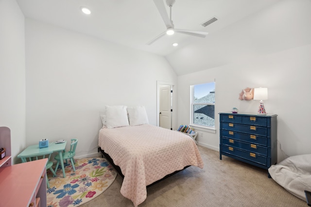 carpeted bedroom featuring ceiling fan and vaulted ceiling