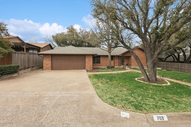 view of front of property with a garage and a front yard