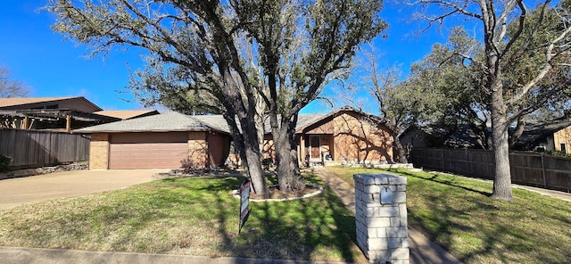 view of front facade with a garage and a front lawn