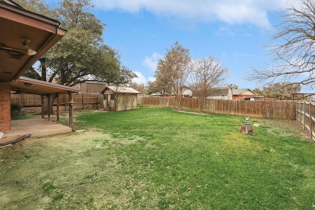 view of yard with an outbuilding and a patio