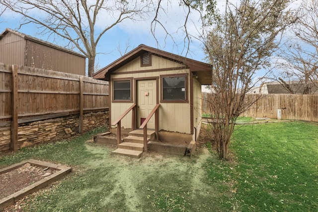 view of outbuilding featuring a lawn