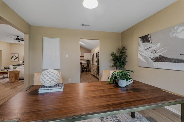 dining space featuring hardwood / wood-style floors and ceiling fan