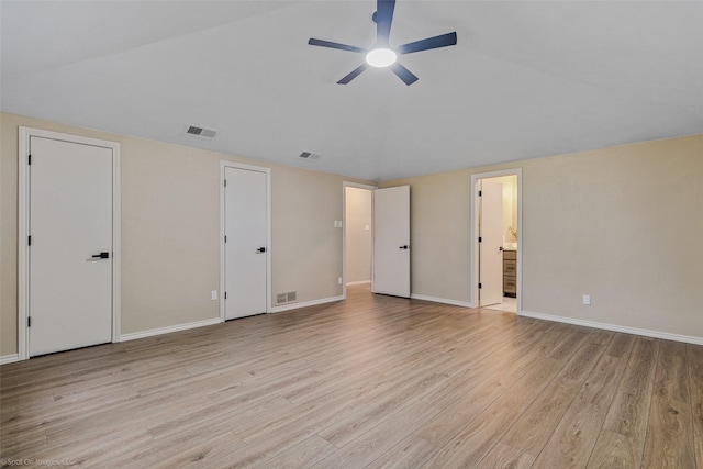 unfurnished bedroom featuring ensuite bath, ceiling fan, and light wood-type flooring