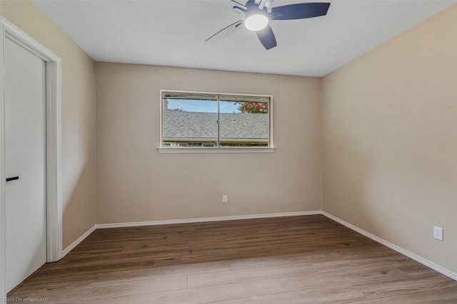 spare room featuring ceiling fan and light wood-type flooring