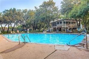 view of swimming pool with a patio