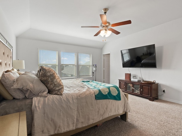 carpeted bedroom featuring ceiling fan and vaulted ceiling