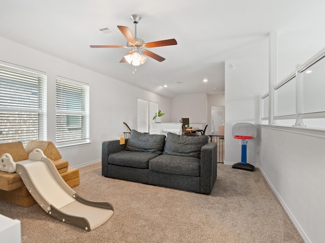 carpeted living room with lofted ceiling and ceiling fan