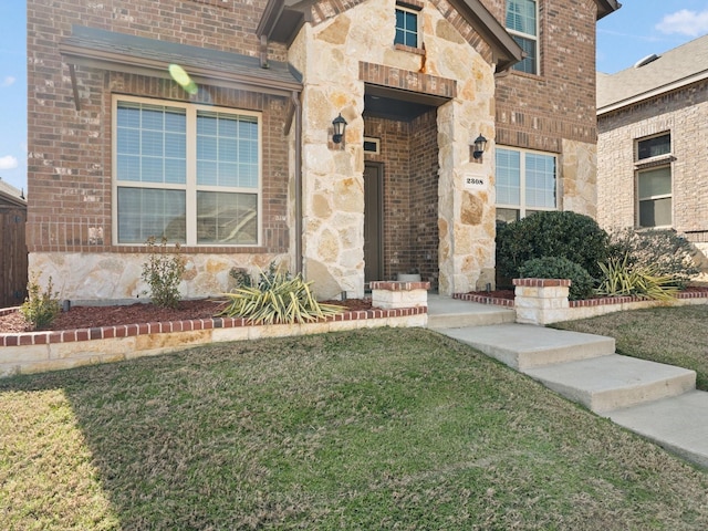 doorway to property with a lawn