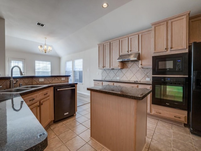 kitchen with sink, tasteful backsplash, vaulted ceiling, a kitchen island, and black appliances