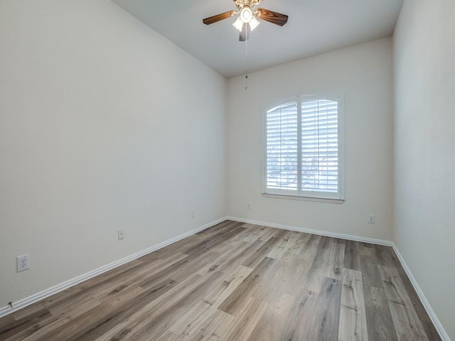 empty room featuring ceiling fan and light hardwood / wood-style floors